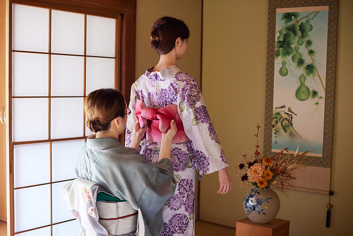 Japanese woman getting dressed