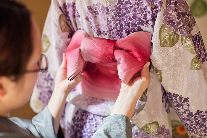 Japanese woman dressing in kimono