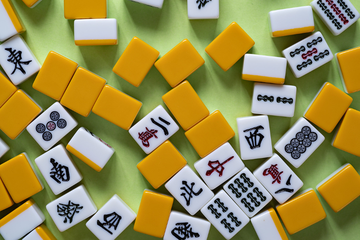 Mahjong tiles on green background
