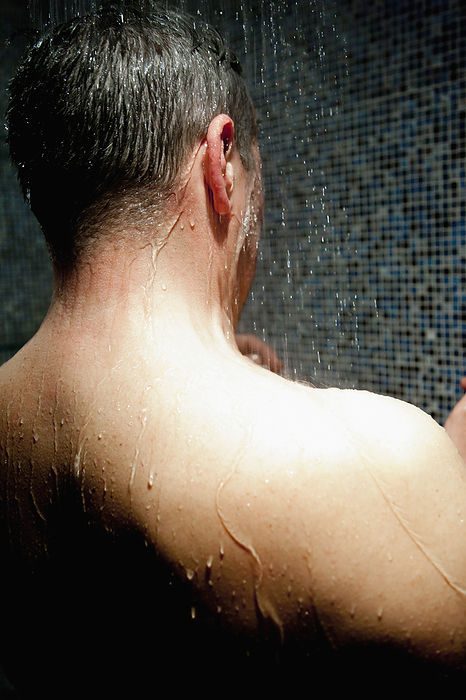 Back View of Man Taking Shower