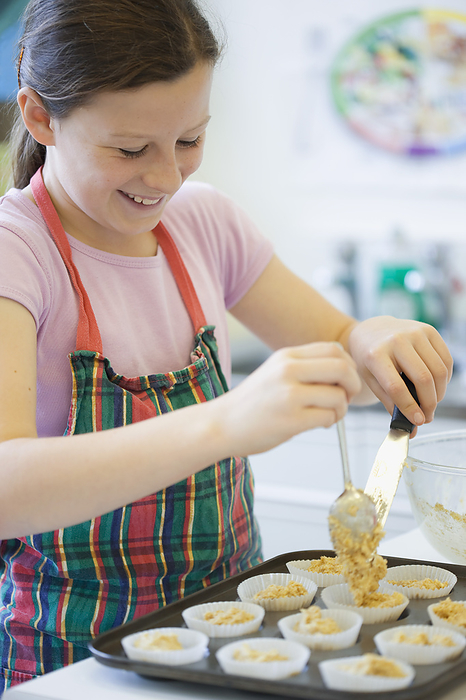 Young girl in cookery class baking