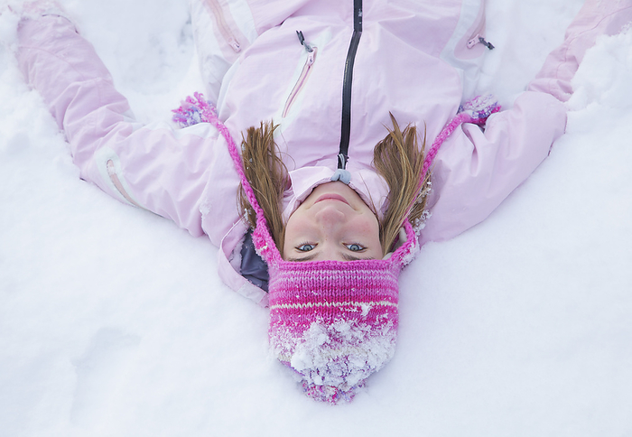 Girl Wearing Pink Woolly Hat in the Snow
