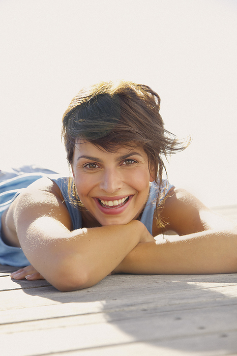 Smiling Woman Lying Outdoors