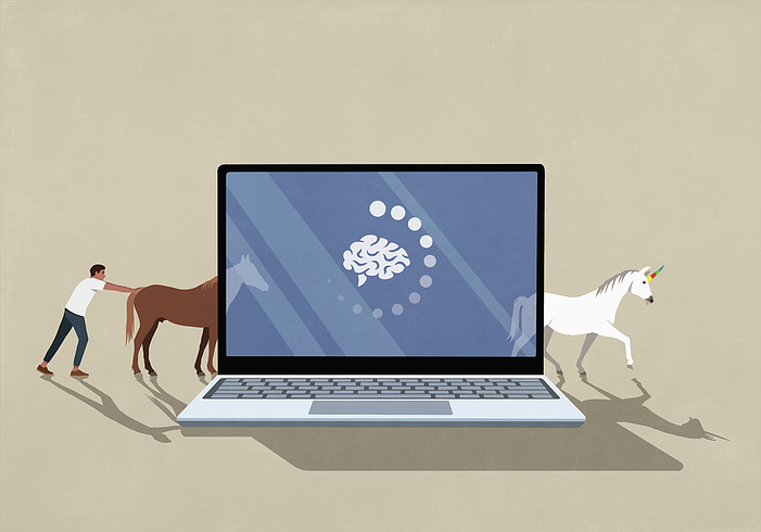 Man transforming horses into unicorns through laptop screen