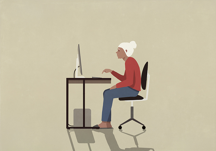 Senior woman using computer at desk