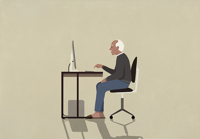 Senior man using computer at desk