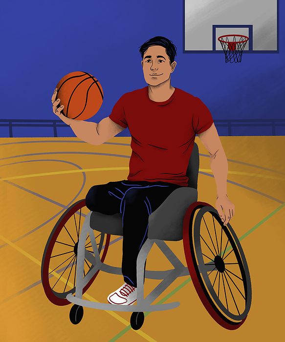 Smiling man in wheelchair playing basketball on basketball court in gymnasium