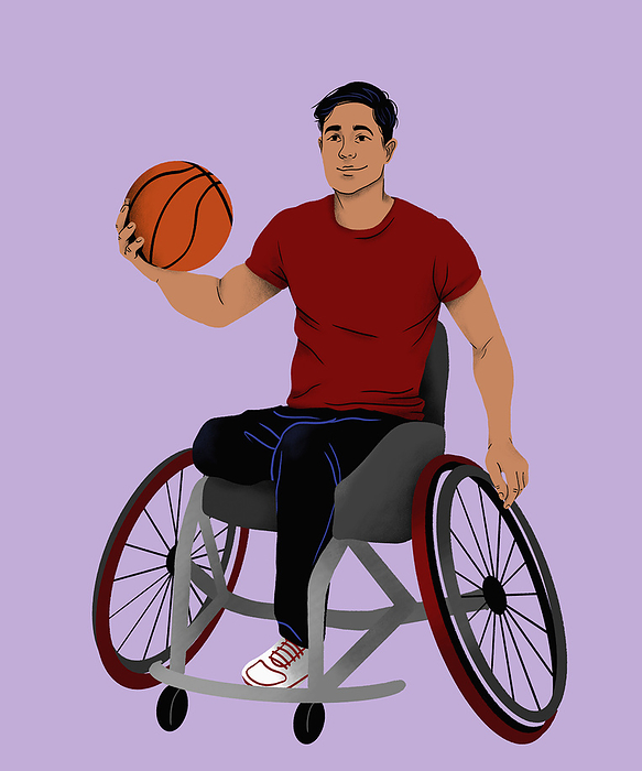 Disabled man in wheelchair playing basketball