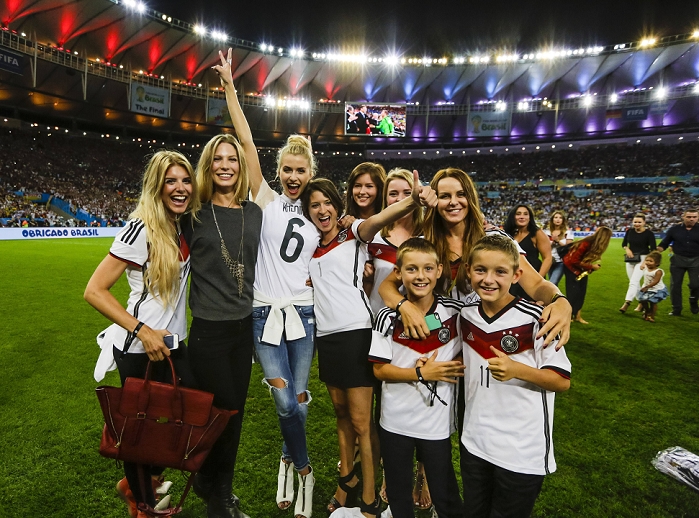2014 FIFA World Cup Final Germany Wins 4th title in 6 tournaments  L R  Lisa Rossenbach, Sarah Brandner, Lena Gercke, Kathrin Gilch, Lena, Lisa Wesseler, Sylwia Klose, JULY 13, 2014   Football   Soccer :  L R  Roman Weidenfeller s girlfriend Lisa Rossenbach, Bastian Schweinsteiger s girlfriend Sarah Brandner, Sami Khedira s girlfriend Lena Gercke, Manuel Neuer s wife Kathrin Gilch, Julian Draxler s girlfriend Lena, Benedikt Howedes  girlfriend Lisa Wesseler, Miroslav Klose s wife Sylwia and her sons celebrate on the pitch after the FIFA World Cup Brazil 2014 Final match between Germany 1 0 Argentina at Estadio do Maracana in Rio de Janeiro, Brazil.  Photo by AFLO 