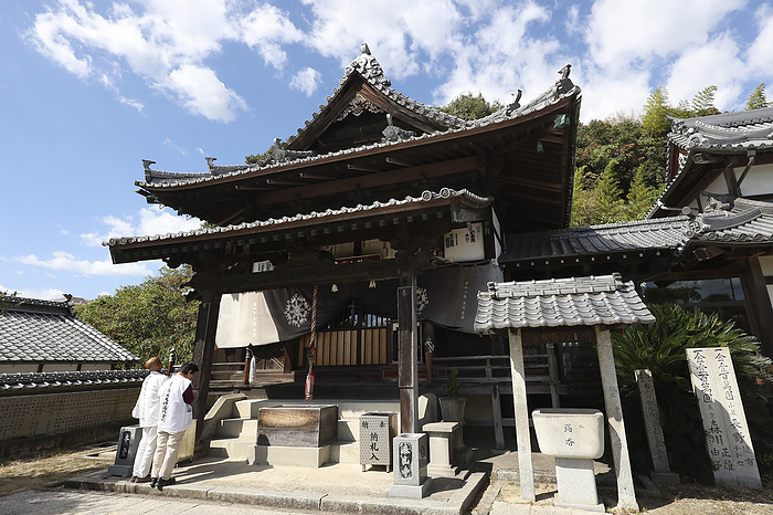 The main hall and pilgrims at No. 56 Taizanji Temple 88 sacred places in Shikoku