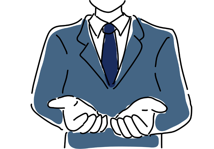 Upper half of businessman in suit receiving with both hands