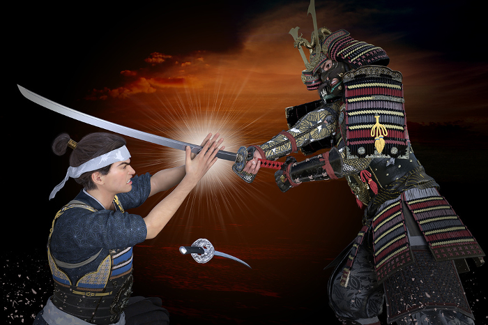 A warlord prevents a sword swinging down on his head with his bare hands in a serious white-edged sword fight.