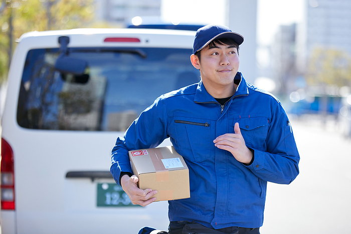 Delivery person carrying packages