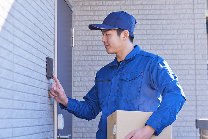 delivery person pushing an intercom