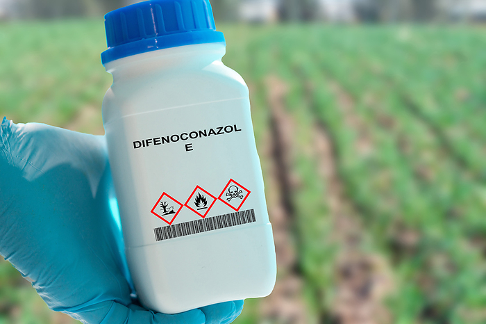 Container of difenoconazole fungicide Container of difenoconazole. A fungicide used to control fungal diseases in crops such as wheat, barley, and rice., by WLADIMIR BULGAR SCIENCE PHOTO LIBRARY