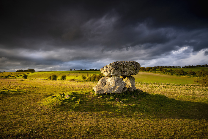 Devil s Den, Marlborough, UK Devil s Den, a dolmen burial chamber on Fyfield Hill near Marlborough, Wiltshire, UK. It dates back thousands of years to the Neolithic period and is part of a wider grave passage in Fyfield Down. It was named after the Devil following the introduction of Christianity to the area. The name was a way to put fear into locals and remind Pagans to convert to the  true faith . Two standing stones, a capstone and two fallen stones are all that remain of what was the entrance to a long mound around 70 metres long., by JEREMY WALKER SCIENCE PHOTO LIBRARY