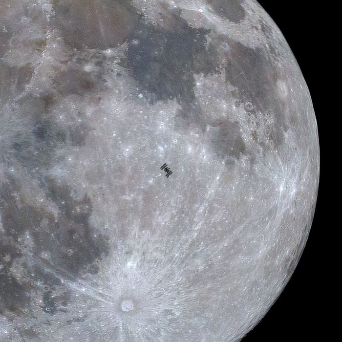 ISS in front of the Moon ISS  International Space Station  silhouetted against a full Moon on the 17th of January 2022. Photographed from Klokocov, Slovakia., by PETR HORALEK SCIENCE PHOTO LIBRARY