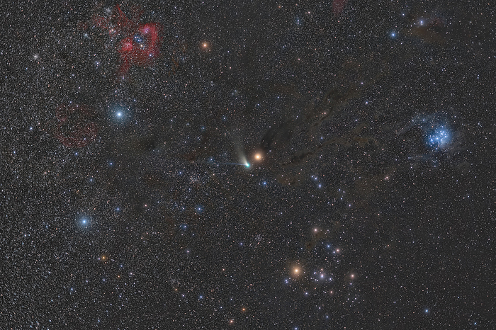 Comet and Mars, composite image Composite image of comet C 2022 E3 ZTF  blue green, centre  and Mars  orange, centre  amongst the constellation Taurus. The Pleiades, a star cluster forming part of Taurus, is visible  bright blue, right  as is the nebula IC 405  red, comma shaped, top left  and just below and to the left of that, star cluster NGC 1893  red circle . Comet C 2022 E3 ZTF is approximately 1 km in diameter, and is predicted to have taken 50,000 years to orbit the Sun. Its close approach to the inner solar system will alter its orbit and could mean that it will permanently leave the solar system. Photographed on 11 February 2023 from the Soneva Jani island observatory, Maldives., by PETR HORALEK SCIENCE PHOTO LIBRARY