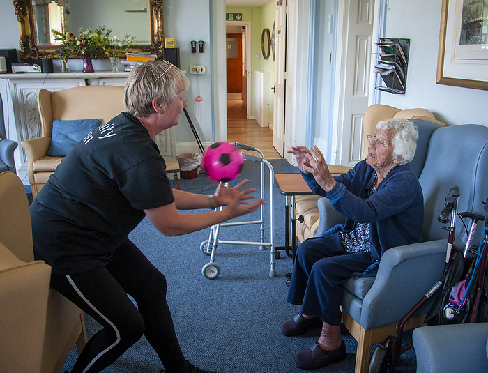 Care home resident taking part in exercise class Care home resident taking part in an exercise class., by JOHN COLE SCIENCE PHOTO LIBRARY