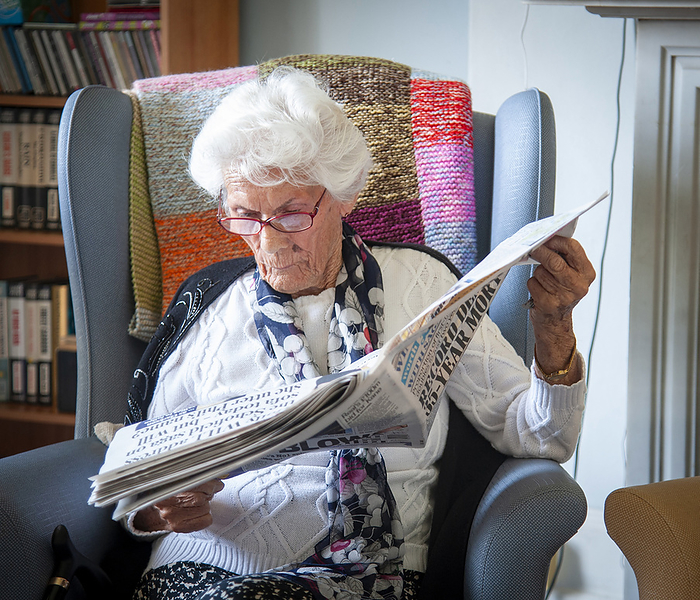 Care home resident reading a newspaper Care home resident reading a newspaper., by JOHN COLE SCIENCE PHOTO LIBRARY