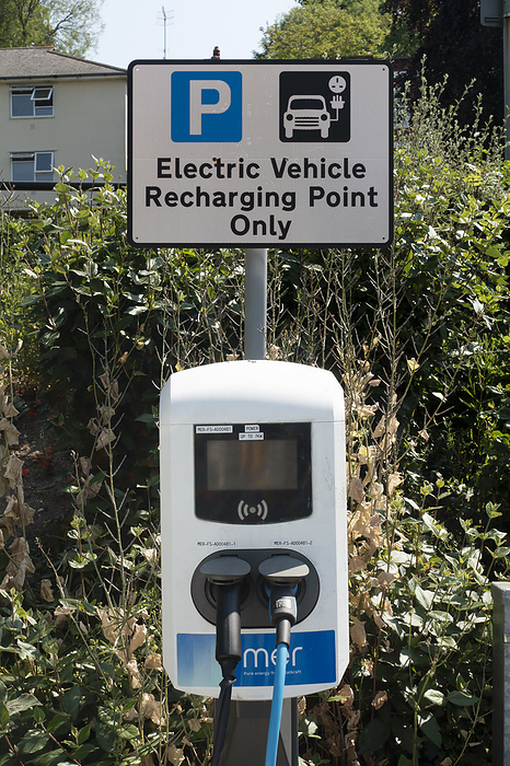 Electric vehicle recharging point Electric vehicle recharging point in a public car park. Photographed in in Guilford, Surrey, United Kingdom, by DR NEIL OVERY SCIENCE PHOTO LIBRARY
