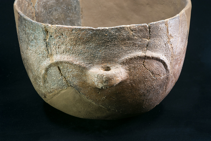 Decorated Neolithic pot Decorated pot found in the surroundings of the Gava variscite mines, which were active between 4200 and 3400 BCE  Neolithic period  in Barcelona, Catalonia, Spain. This pot may have been used by the mine workers for cooking and has a hole in the handle which could have been used for hanging., by MARCO ANSALONI   SCIENCE PHOTO LIBRARY