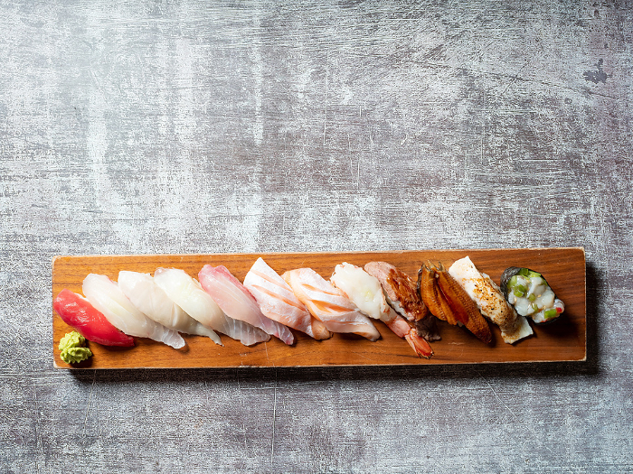 Various sushi on wooden tray