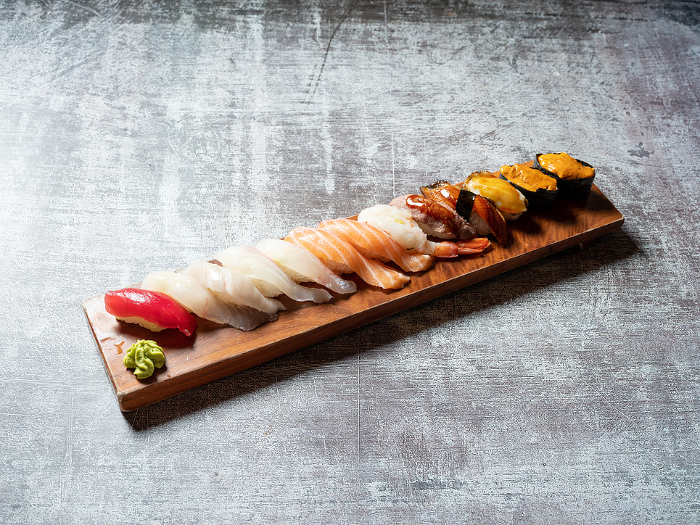 Various sushi on wooden tray