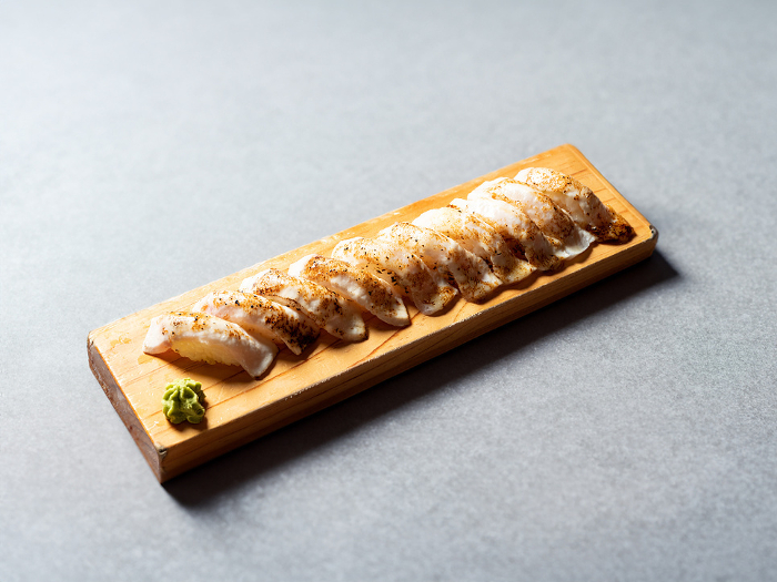 Grilled tuna sushi on a wooden tray