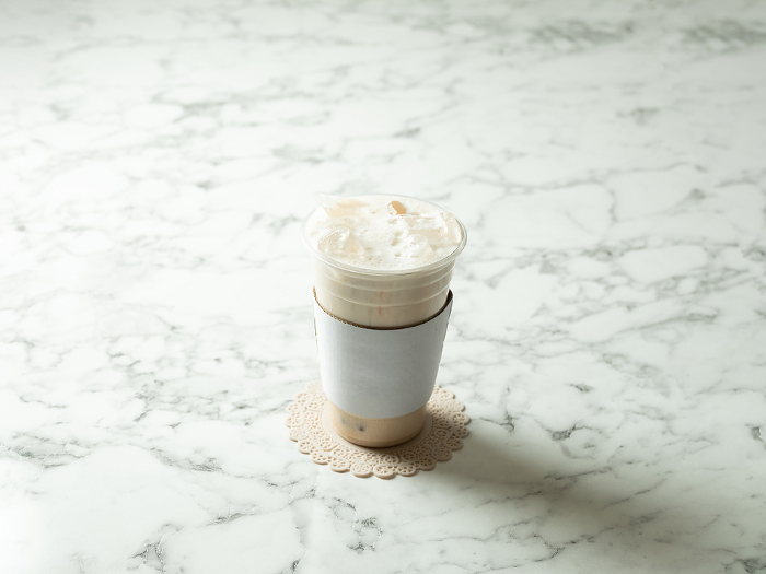Iced multigrain latte in a take-out cup