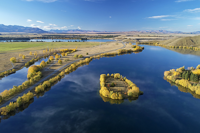 New Zealand Kellands Pond  left , State Highway 8, and Wairepo Arm, Twizel, Mackenzie District, North Otago, South Island, New Zealand   drone aerial