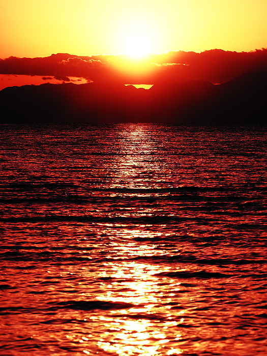 From Zushi Beach, the sun sets over Sagami Bay and the Izu Peninsula.