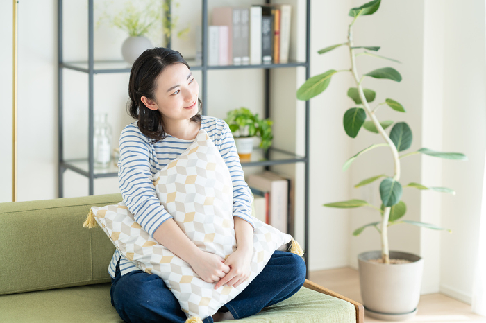 Young Japanese woman relaxing in the living room (People)