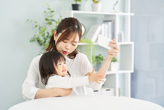 A Japanese mother takes her phone away from her child.