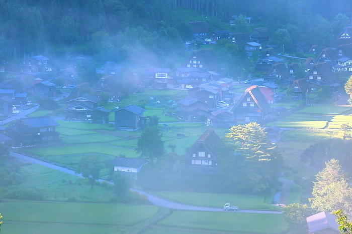 Shirakawa-go's Gassho-Zukuri Village, Shirakawa Village, Gifu Prefecture, Japan, shrouded in summer morning mist