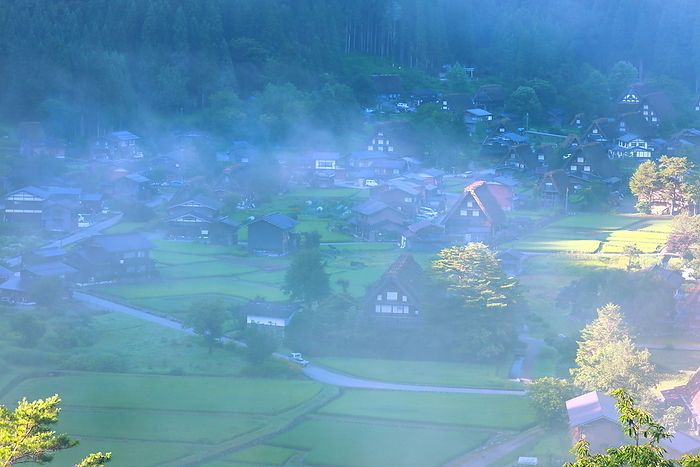 Shirakawa-go's Gassho-Zukuri Village, Shirakawa Village, Gifu Prefecture, Japan, shrouded in summer morning mist