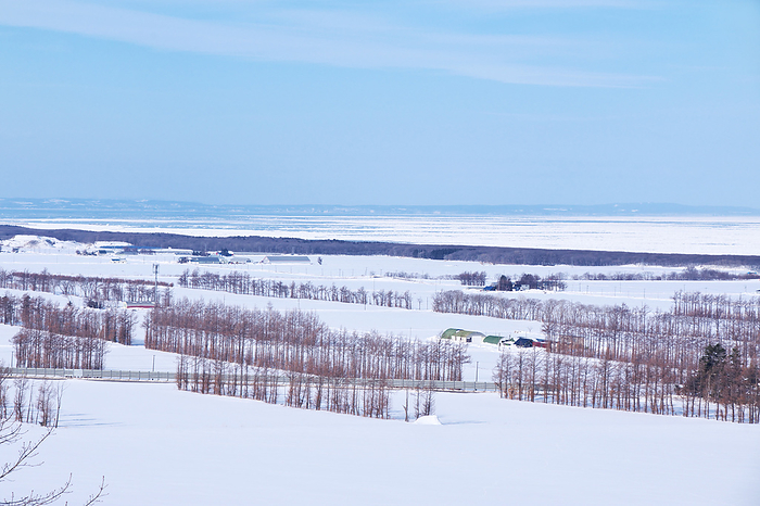 Rural landscape of drift ice and snow on the Sea of Okhotsk, Hokkaido  2 C, from the observatory on the road to heaven