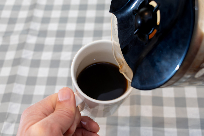 Pour coffee into the mug in your hand.