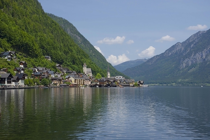 Hallstatt, a charming village on the Hallstattersee lake and a famous tourist attraction, with beautiful mountains surrounding it, in Salzkammergut region, Austria, in summer sunny day, Europe, by Aron M