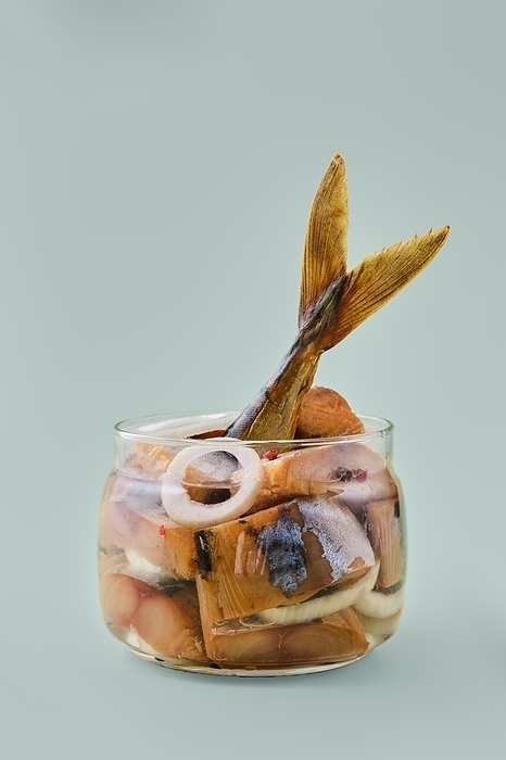 Transparent glass pot with sliced mackerel marinated with pepper and onion, by Aleksei Isachenko