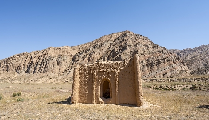 Clay mausoleum, tombstones, old Kyrgyz cemetery, between dry eroded landscape, Naryn region, Kyrgyzstan, Asia, by Mara Brandl