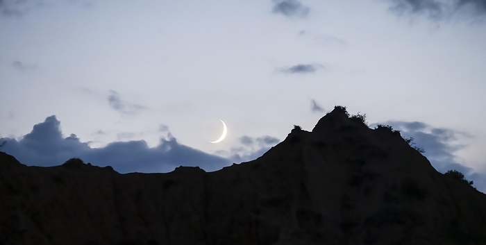 Moon in front of a mountain silhouette, Konorchek Canyon, Chuy, Kyrgyzstan, Asia, by Moritz Wolf