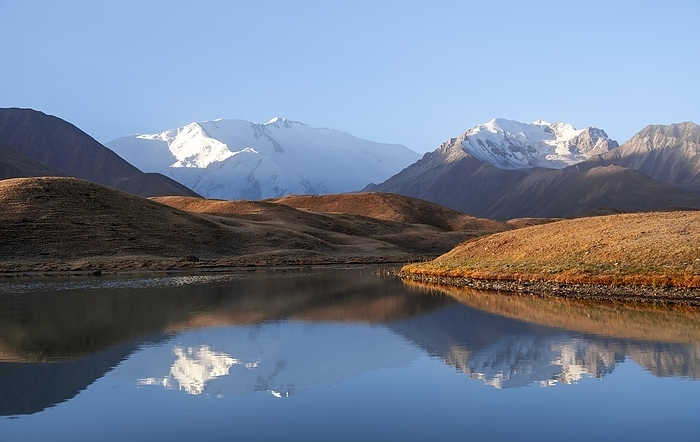 Morning atmosphere, mountains reflected in a small mountain lake, Pik Lenin, Trans Alay Mountains, Pamir Mountains, Osh Province, Kyrgyzstan, Asia, by Moritz Wolf