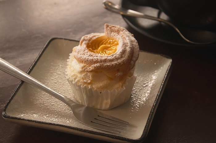 Close up of a brazo de mercedes cupcake, a popular authentic Filipino dessert. Dipolog, Philippines, Asia, by MartinxMarie