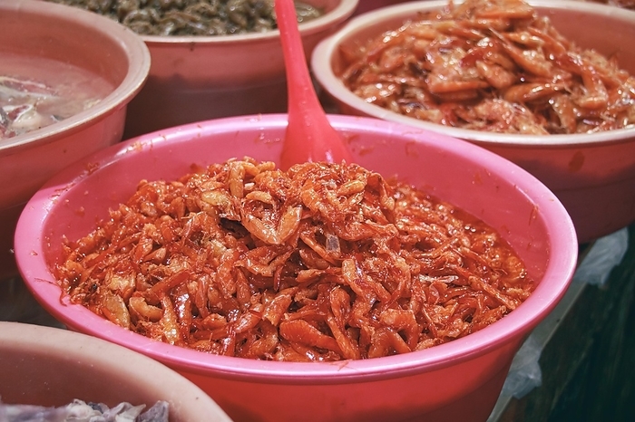 Traditional khmer fermented shrimps in a container at a market stall showing the authentic cambodian exotic cuisine and culture. Kampot, Cambodia, Asia, by MartinxMarie