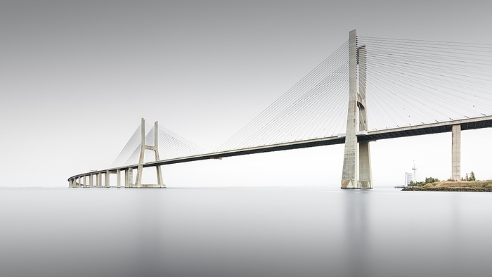 Minimalist long exposure of the famous Ponte Vasco da Gama bridge over the Tagus in Lisbon, Portugal, Europe, by Ronny Behnert