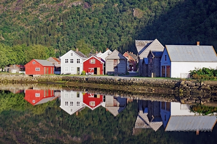 Wooden houses reflected in calm waters, high mountains, Sognefjord, Laerdal, Norway, Europe, by Reinhard Pantke