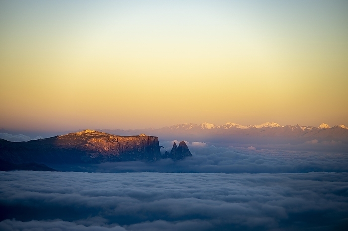 Sunrise over a sea of fog with the peaks of the Sella massif in the background, Corvara, Dolomites, Italy, Europe, by Robert Seitz