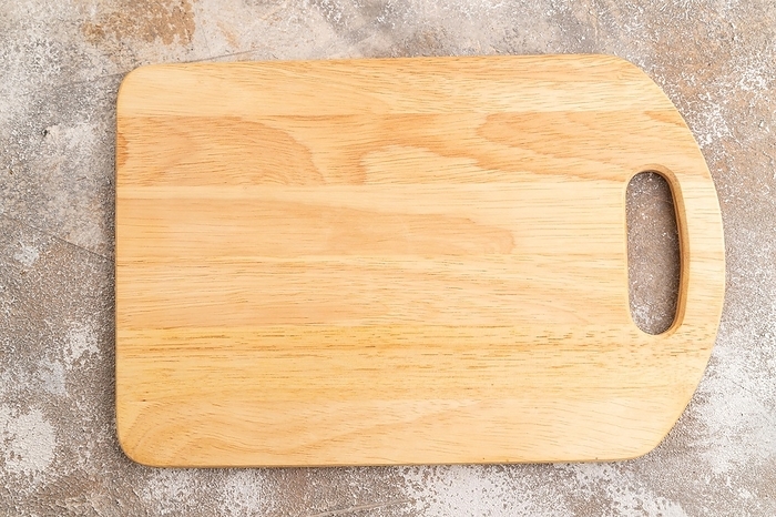 Empty rectangular wooden cutting board on brown concrete background. Top view, close up, flat lay, by ULADZIMIR ZGURSKI