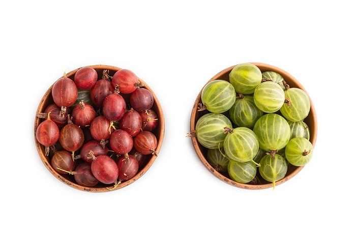Fresh red and green gooseberry in clay bowl isolated on white background. top view, flat lay, close up, by ULADZIMIR ZGURSKI